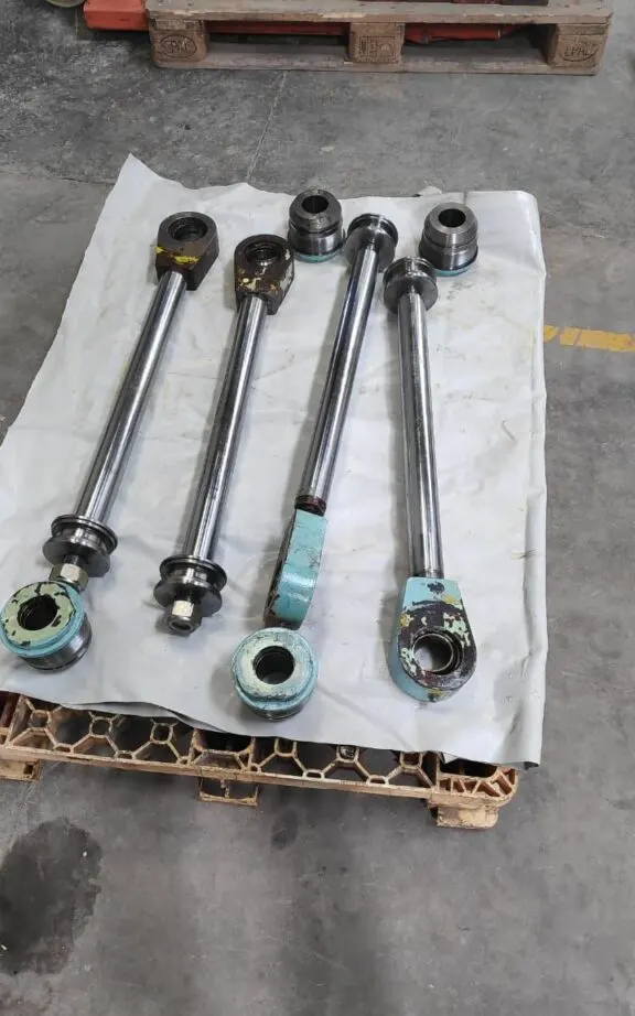 Cylinder rods with pistons and eye ends out for inspection
